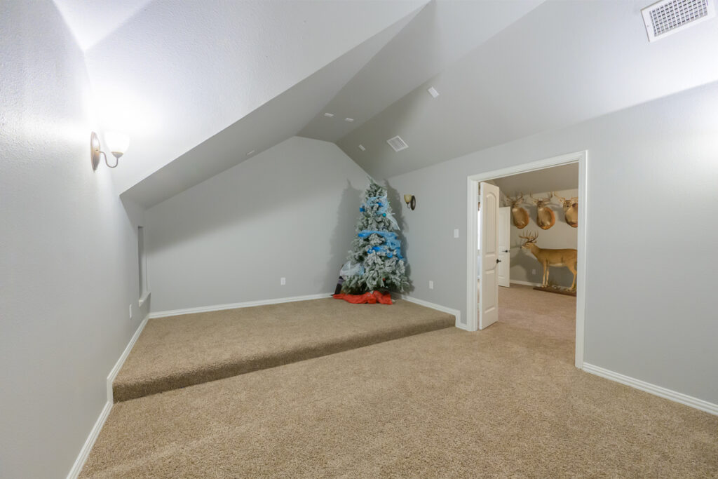 Real Estate Photography: Media Room Transformation - Before and After. Discover the removal of a Christmas tree, unveiling the room's full potential.
